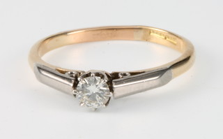 An 18ct yellow gold single stone diamond ring, size P 1/2