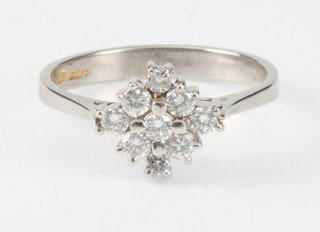 An 18ct white gold 9 stone diamond cluster ring size L 1/2 