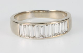 An 18ct white gold 12 stone baguette cut diamond ring size N