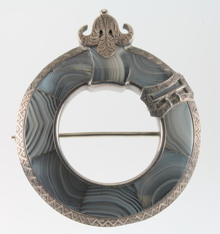 A large Scottish silver hardstone brooch with scroll crest 2 1/2" diam. 