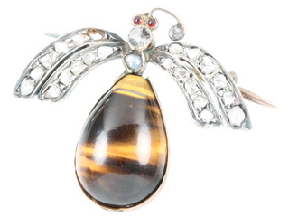 A Victorian bug brooch, the body in the form of a cabochon cut tiger's eye, the wings with diamond chips, a pearl body and garnet eyes