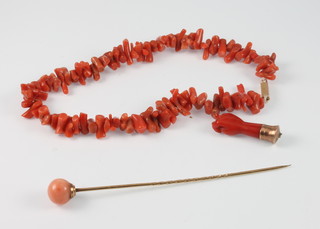 A Victorian natural coral bracelet, a ditto spherical mounted tie pin and a clasp hand charm 