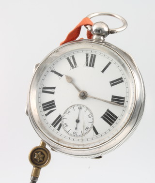 A silver engine turned key wind pocket watch with seconds at 6 o'clock 