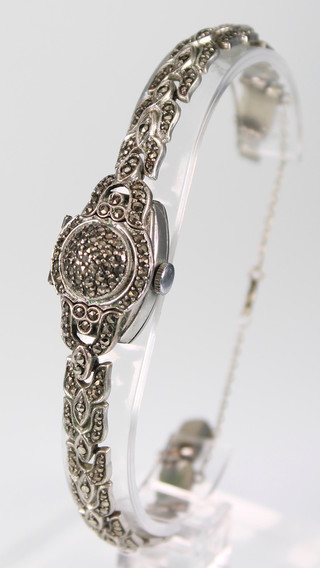 A lady's 1930's chromium and steel marcasite wristwatch with hidden dial 