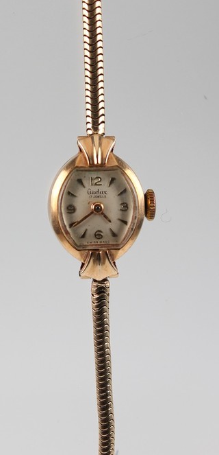 A lady's 9ct yellow gold Audax wristwatch on a ditto bracelet 