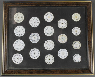 18 enamelled pocket watch dials, framed