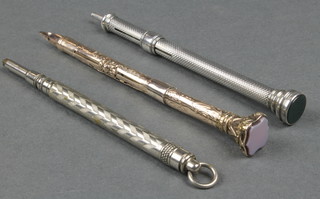 An Edwardian gilt dip pen with hardstone terminal, a Mordan & Co silver pencil and 1 other 