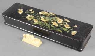 A 19th Century carved ivory figure of a reclining lady 2 1/2" and a painted glove box