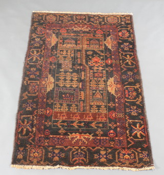 A contemporary Persian Balochi red and black ground belouche rug decorated stylised buildings 61" x 37" 
