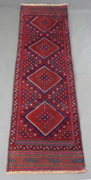 A contemporary red and blue ground Meshwani runner with 4 diamonds to the centre 91" x 25" 