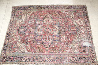 A Persian Heriz white and blue ground carpet with stylised urn to the centre, some wear, 152" x 116"