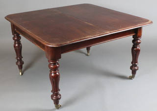 A Victorian rectangular mahogany extending dining table with 2 extra leaves, raised on turned supports 28"h x 47 1/2"w x 48" when closed x 94" when fully extended 