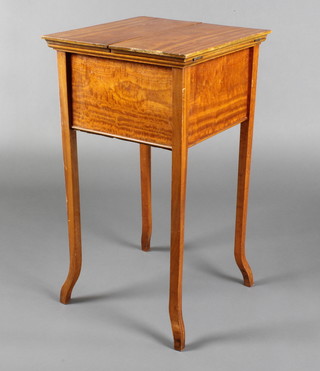 An Edwardian square satinwood work box with hinged lid, raised on square tapered out swept supports 29"h x 16"w x 16 1/2"d 