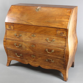 An 18th Century Dutch bureau of bombe form, the fall front revealing a stepped fitted interior and well above 2 short and 3 long graduated drawers, raised on bracket feet 44"h x 44"w x 21 1/2"d 