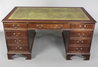 A mahogany kneehole desk with green leather inset writing surface, fitted 1 long and 8 short drawers, raised on bracket feet 30"h x 60"w x 36"