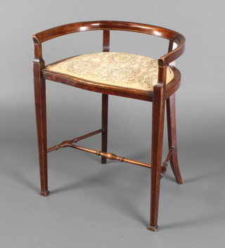 An Edwardian inlaid mahogany tub back piano stool, raised on square tapering supports with H framed stretcher 