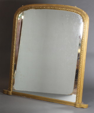 A Victorian arch shaped over mantel mirror contained in a decorative gilt frame 58"h x 58"w 