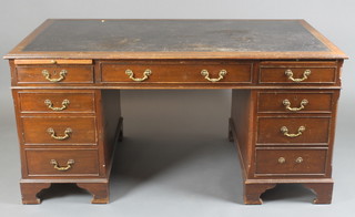 A Georgian style mahogany desk with black leather writing surface, the base fitted 2 brushing slides above 1 long and 8 short drawers with brass swan neck drop handles, raised on bracket feet 30"h x 61"w x 34"d 