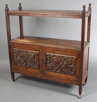 A Victorian carved oak 2 tier buffet, the base enclosed by panelled doors 52"h x 49"w x 16"d  