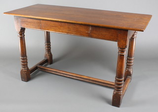 A 19th Century rectangular oak side table fitted a frieze drawer, raised on turned and block supports with H framed stretcher 30"h x 54"w x 24"d