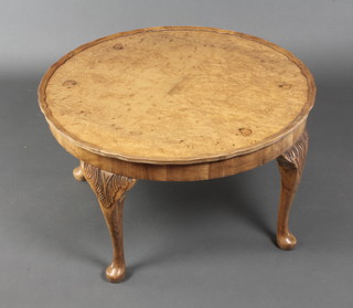 A Queen Anne style circular figured walnut coffee table with quarter veneered top with pie crust edge, raised on cabriole supports 17"h x 30" diam. 