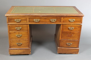 A Victorian mahogany pedestal desk with green inset writing surface, fitted 1 long and 8 short drawers, raised on a platform base 29"h x 51"w x 27"d 