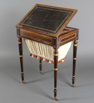 A Victorian rosewood rectangular writing/work table with black inset writing surface, fitted a drawer with inkwell and deep basket, raised on ring turned supports 29 1/2"h x 23"w x 16"d  