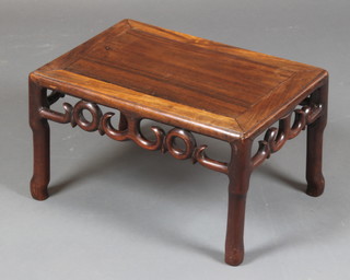 A rectangular Chinese Padouk occasional table with carved and shaped apron 11"h x 19"w x 13"d 