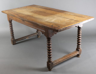A 17th/18th Century rectangular oak table raised on bobbin turned supports with bun feet, the top formed of 4 planks 30"h x 67"w x 32"d 