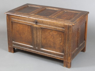 A 17th Century oak coffer of panelled and joined construction with hinged lid, the interior fitted a candle box, the lid marked MA 21"h x 35"w x 19"d 