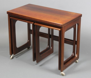 A H McIntosh, a 1960's/70's rectangular rosewood nest of interfitting coffee tables with flip over top, 23 1/2"h x 29"w x 16" when closed by 32" when open