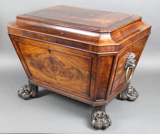 A good Georgian mahogany wine cooler of sarcophagus form, the moulded lid with three quarter veneered top, having brass lion ring drop handles to the sides, raised on paw feet, 23"h x 30"w x 22"d 