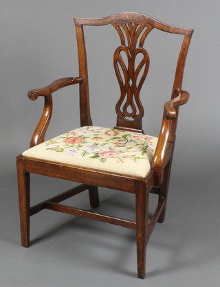 A 19th Century oak Chippendale style carver chair with pierced vase shaped slat back and upholstered seat, raised on square tapering supports with H framed stretcher 