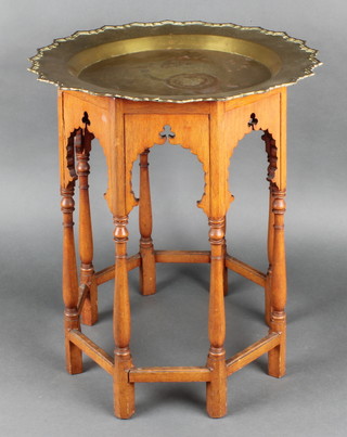 An octagonal Moorish style pierced table base, the interior marked A & C, raised on turned and block supports 20"h x 13"w together with an associated brass top 