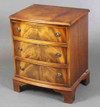 A Georgian style mahogany bow front chest of 3 long drawers, raised on bracket feet 26"h x 21"w x 16 1/2"d 