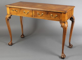 A Queen Anne style figured walnut side table with feather and crossbanded top, inlaid stylised Sunburst above 2 short drawers, raised on carved cabriole ball and claw supports 34"h x 48"w x 20"d 