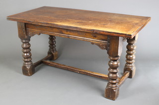 A 17th Century style oak draw leaf dining table raised on turned supports with H framed stretcher 30"h x 59" x 90" when fully extended x 30"w 