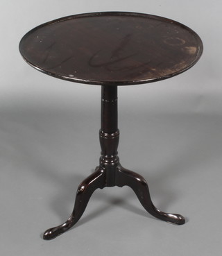A 19th Century turned mahogany dish top wine table, raised on pillar and tripod base 26"h x 23" diam