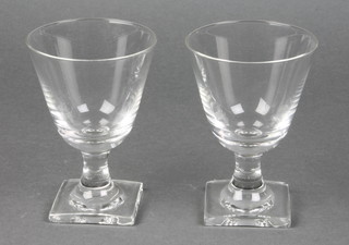A set of 9 Orrefors wine glasses on square feet
