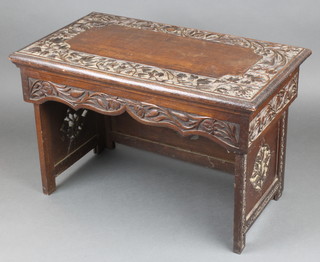 A Burmese carved hardwood folding table 14"h x 22"w x 12"d 
 