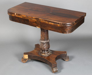 A William IV rosewood D shaped card table raised on a turned column with triform base and scrolled feet 29 1/2"h x 36"w x 18"d 
