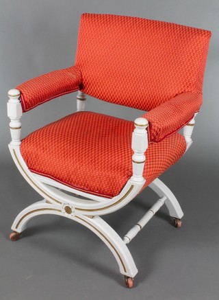 An Italian style grey painted X framed open arm chair upholstered in orange coloured material 