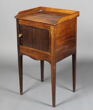 A Georgian mahogany commode with three-quarter gallery, the interior enclosed by a tambour shutter raised on square tapered supports 32"h x 17 1/2"w x 15"d 
