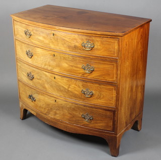 A Georgian mahogany bow front chest with crossbanded top and satinwood stringing, fitted 4 long drawers with brass plate drop handles, raised on splayed bracket feet 38"h x 40"w x 22 1/2"d 