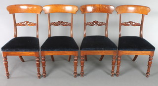 A set of 4 William IV mahogany  bar back dining chairs with carved mid rails and upholstered drop in seats, on turned supports 