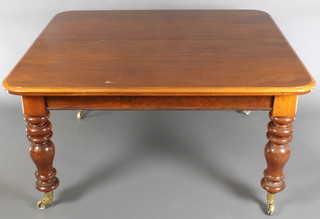 A Victorian mahogany rectangular extending dining table raised on turned supports brass caps and casters, together with 4 pine leaves, 28"h x 53"w x 48" x 106" when fully extended 