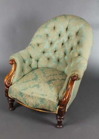 A Victorian mahogany show frame tub back chair upholstered in green buttoned back material (frame is loose) on turned supports 
