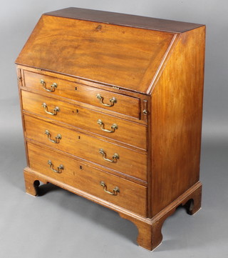A George III mahogany bureau, the fall front revealing a well fitted interior above 3 long graduated drawers with brass escutcheons and swan neck drop handles raised on bracket feet 41"h x 36"w x 18"d  