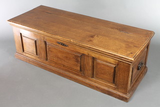 A 19th Century panelled oak coffer with hinged lid and iron drop handles  17"h x 47"w x 16"d 