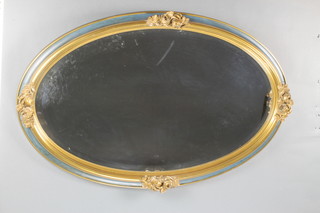 An Edwardian oval bevelled plate wall mirror contained in a blue gilt painted frame decorated roses 24"h x 38"w